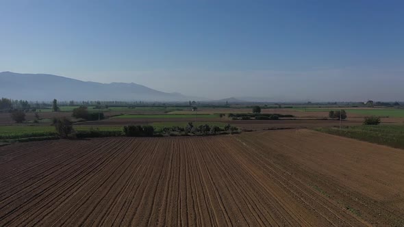 Farms and Fields over the Plain