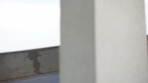 Athlete Runs Around By Levels of an Empty Parking Garage alt