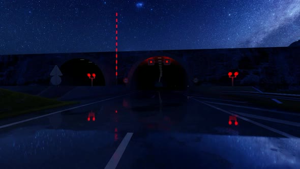 Passing Through the Tunnel on a Wet Road at Night alt