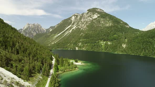 Aerial view of lake with green water near the Cave del Predil, Itally. alt