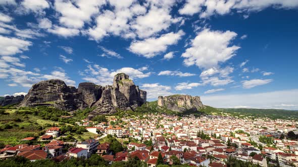 Timelapse view of Meteora rocks and Kalambaka village at daytime with great clouds and sunshine