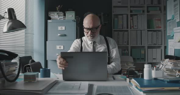 Businessman sitting at desk and working