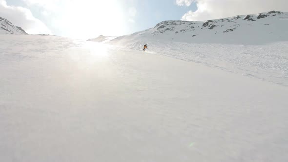 Skier Skiing Off Piste in Sunlight
