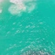 Aerial top down view of waves gently crashing on Kelingking Beach in Bali - VideoHive Item for Sale