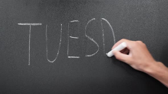 Tuesday written on chalkboard. alt