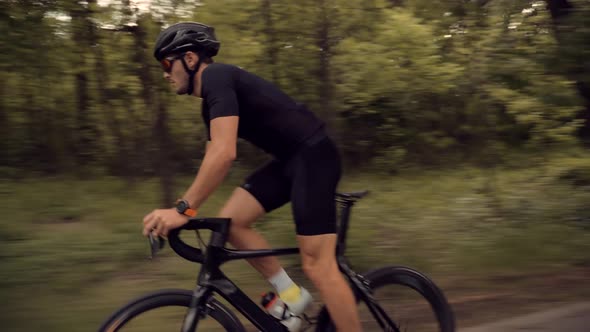 Cycling Fitness Men Pedaling Road Bicycle On Park. Cyclist Endurance Riding On Sport Bike. Cardio. alt