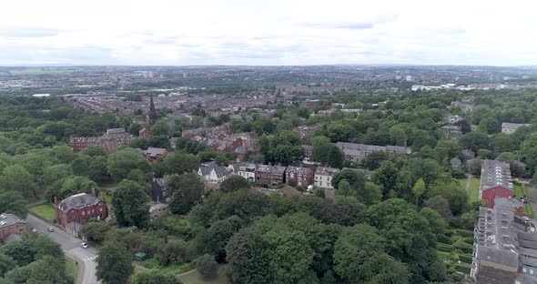 Aerial push in over suburban Leeds in England alt
