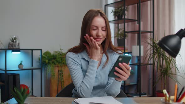 Young Winner Woman Freelancer Use Mobile Smartphone Good News Celebrate Victory Say Wow Yes alt