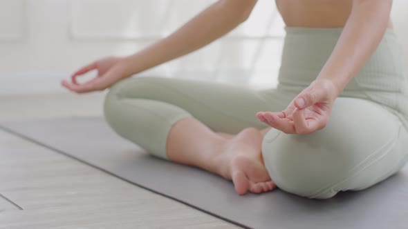 Close up hands of Wellness woman doing yoga lotus pose at in the morning to deep breath alt