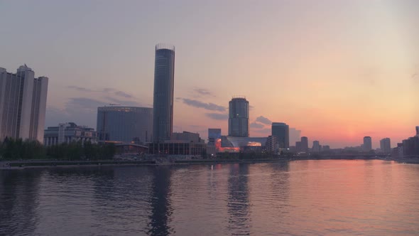 View From the Air at a Beautiful Pink Sunset Over the River in the City Centre