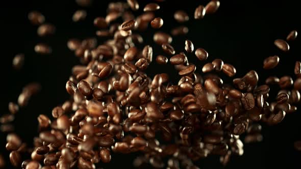 Super Slow Motion Shot of Exploding Premium Coffee Beans at 1000Fps. alt