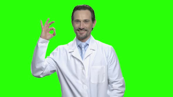 Middle Aged Male Caucasian Doctor with Ok Sign alt