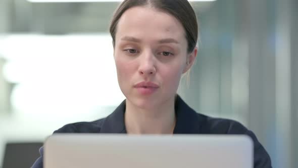 Portrait of Young Businesswoman Talking on Video Call on Laptop alt