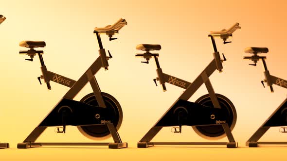 Fitness Bicycles or spinning bikes in the modern gym. Cardio, health, loopable. alt