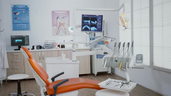 Revealing Shot of Stomatology Chair with Nobody in It alt