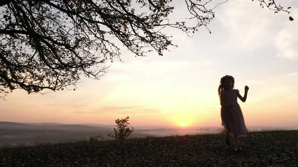 Girl running on a hill alt