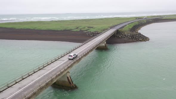 Iceland Car with Bridge at Black Beach alt