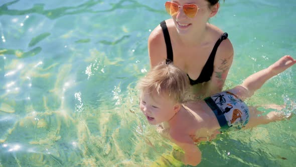Swimming in Sea Good Wellness Procedure for Mother Child alt