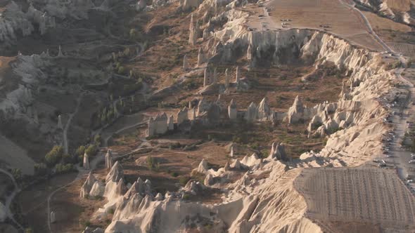 Brown Bare Rocky Hills Surrounded By Wide Brown Fields alt