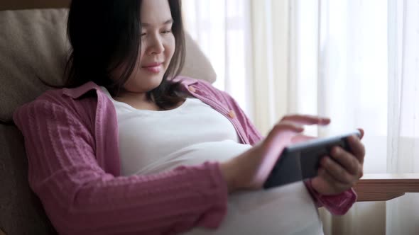 Happy Pregnant Woman and Expecting Baby at Home alt