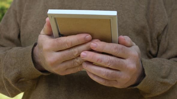 Aged Male Hugging Photo Missing Children, Sad Widower Remembering Wife Nostalgia