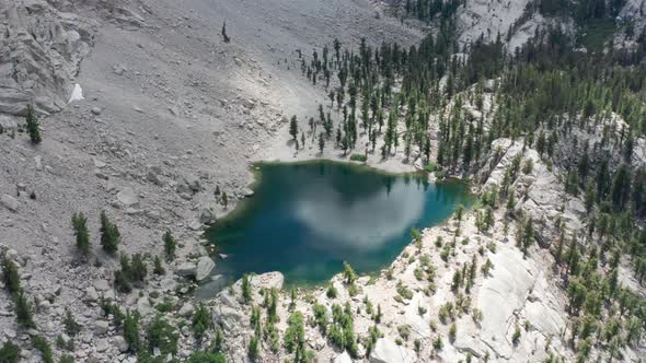 Scenic Aerial Greenblue Glacier Mountain Lake with Sky and Clouds Reflection alt