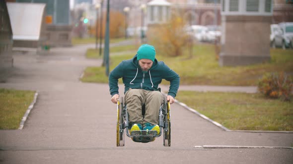 Disabled Man in Wheelchair Makes Failed Attempt To Steer His Wheelchair Over a Ramp and Rolls Down alt
