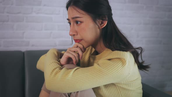 Depressed Woman Crying at Home alt