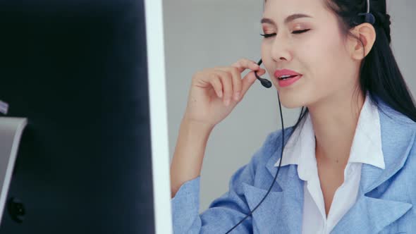 Customer Support Agent or Call Center with Headset Talking to Customer on Phone alt