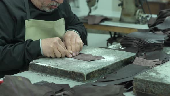 Shoemaker Gluing Leather In Shoe Factory