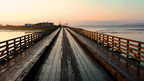 Wooden bridge in Dublin at sunrise. alt
