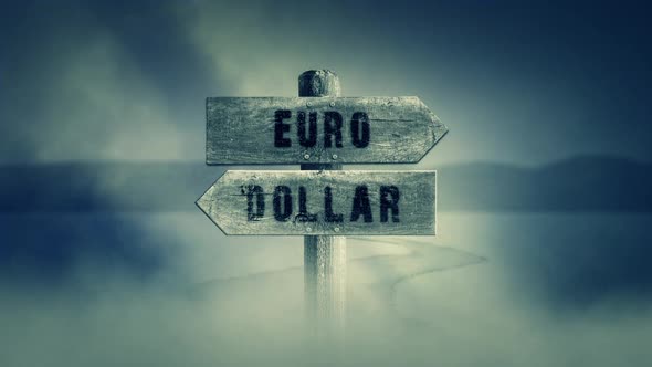 Old Wooden Sign On A Middle Of A Cross Road With The Words Euro Or Dollars alt