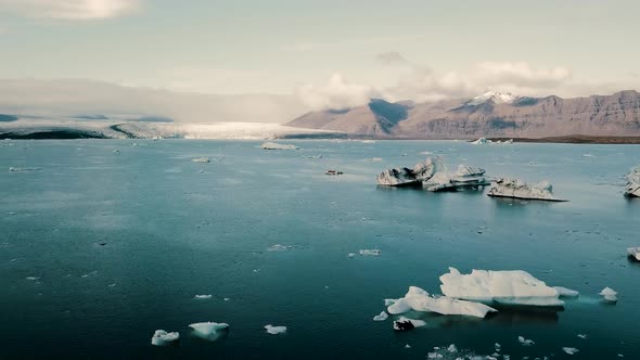 Diamond Beach Jokulsarlon Glacier Lagoon Icebergs in Iceland Aerial Drone View. alt