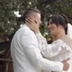 Newlyweds Caucasian Groom with Bride Walking Embracing Hugs in Park Wedding Couple in Love
