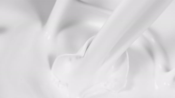 Super Slow Motion Shot of Pouring Fresh Milk at 1000Fps alt
