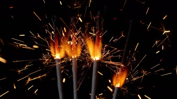 Bengal Fires New Year Sparkler Candles Sparkling Lights Burning on a Black Background Slow Motion alt