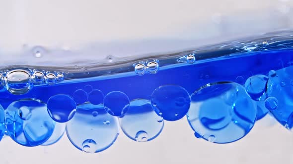Blue Wave Water with Bubbles on White Background alt