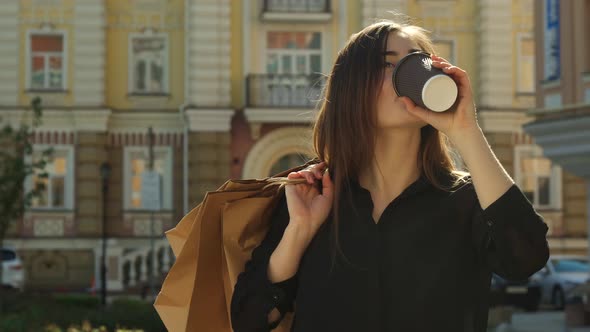 Girl Drinks Coffee on the Street alt