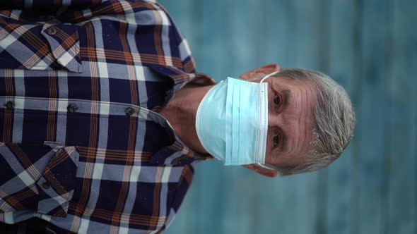 An Old Man Is Using Face Mask for Protect From Virus Against the Second Wave Quarantine Coronavirus alt