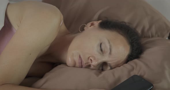 Woman Asleep with Telephone alt