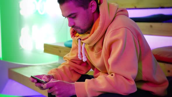 Online Game Addict is Playing By Smartphone alt