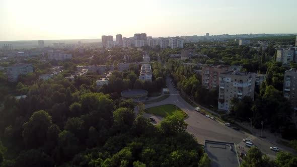 Aerial sunset cityscape with buildings and streets