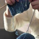 Adult woman knitting woolen knitwear clothing holding needles from blue yarn - VideoHive Item for Sale