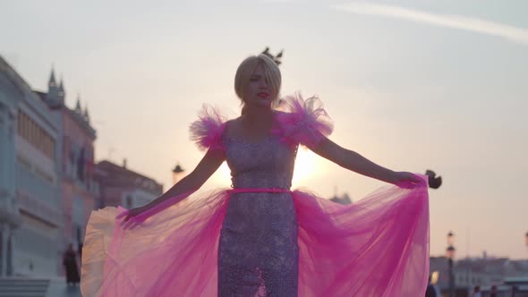 Girl with Pink Dress Poses in Venice alt