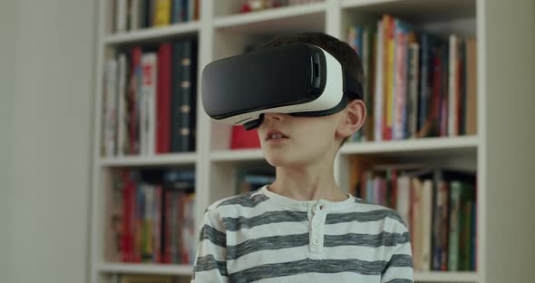 Boy Wearing Virtual Reality Headset Looking Around