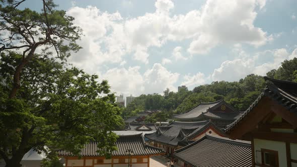 High angle view of Bongeunsa Buddhist Temple against white clouds in Seoul, South Korea alt