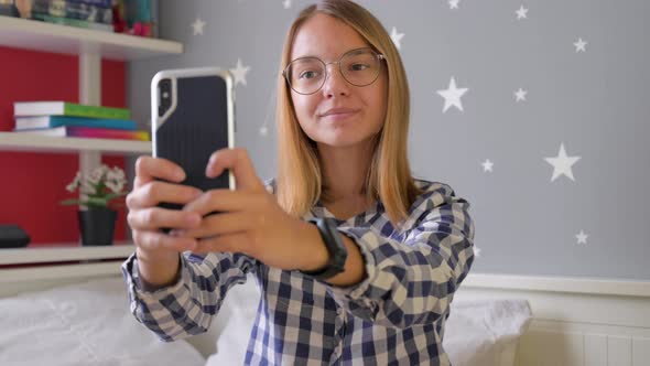 Teen Girl Taking Selfie Using Smartphone
