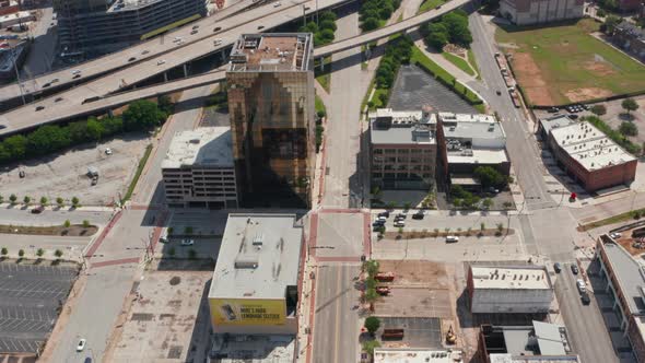 Aerial View of Various Buildings Along Highway alt