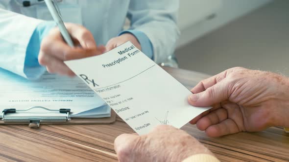 Doctor giving medical form to patient