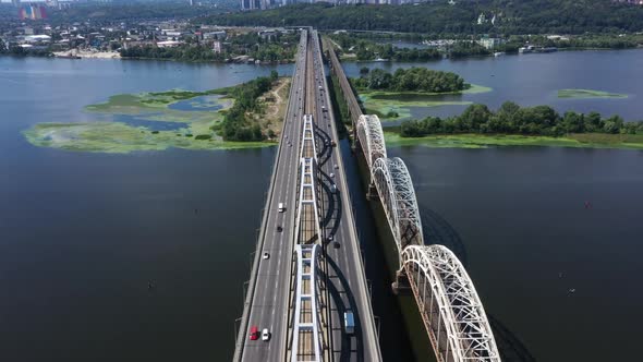 Traffic on the Darnytsky Bridge Over the River Dnipro in Kyiv - Aerial FHD Shot alt